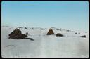 Image of Cairns and Demolished Tent in Baffin Land